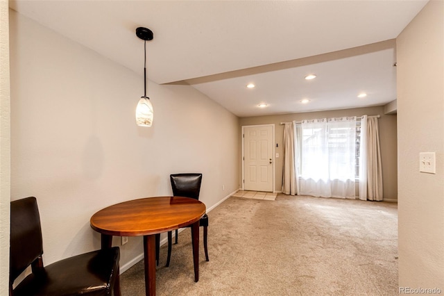 sitting room with light carpet and vaulted ceiling