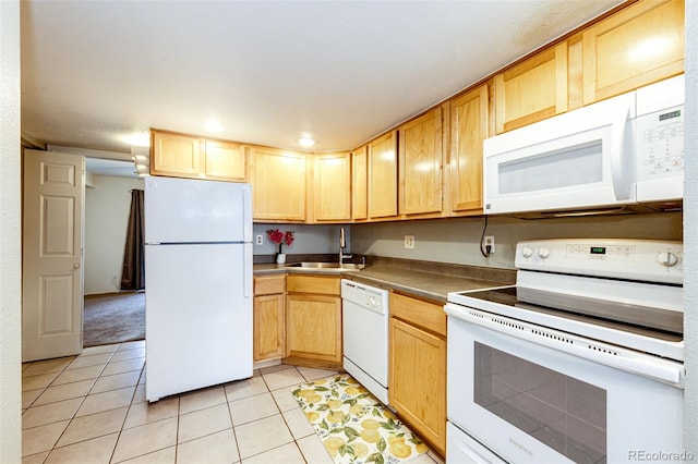 kitchen featuring light tile patterned flooring, white appliances, sink, and light brown cabinetry