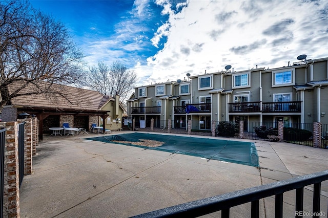 view of swimming pool featuring a patio area