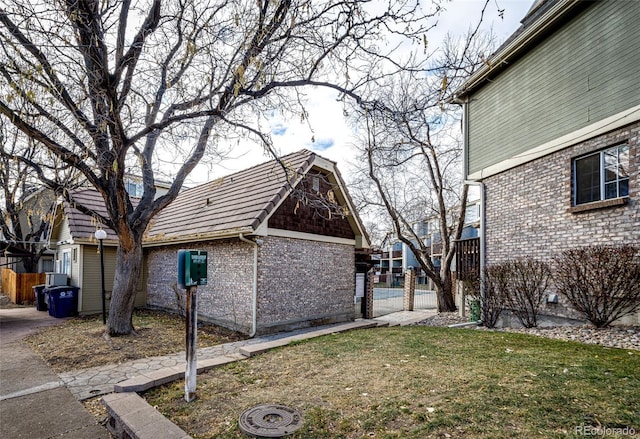 view of side of home featuring a yard