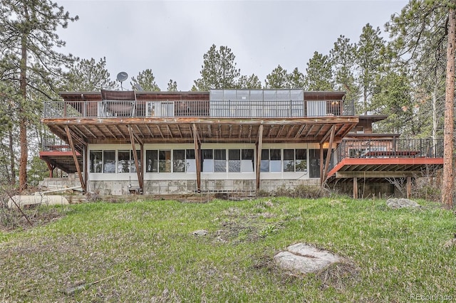 rear view of property with a deck