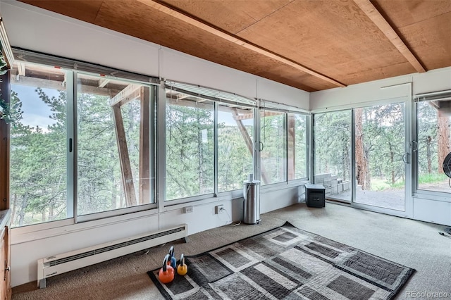 unfurnished sunroom featuring a wealth of natural light and baseboard heating