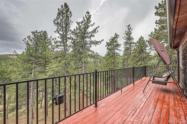 deck featuring a wooded view
