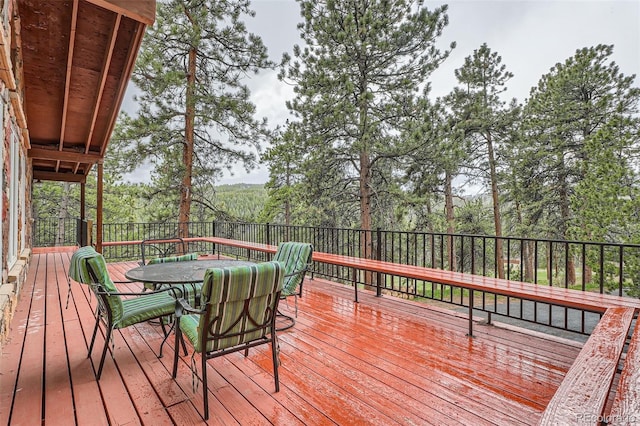 wooden deck with outdoor dining area