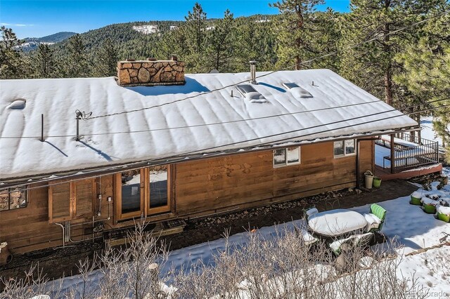 21191 Pleasant Park Rd, Conifer, CO 80433 - rear view of house with a forest view and a mountain view