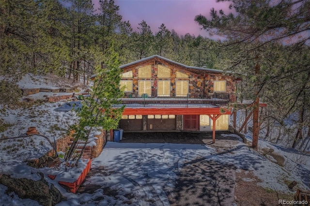 21191 Pleasant Park Rd, Conifer, CO 80433 - patio terrace at dusk with a garage