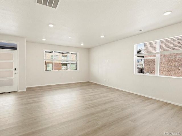 empty room with light wood-type flooring