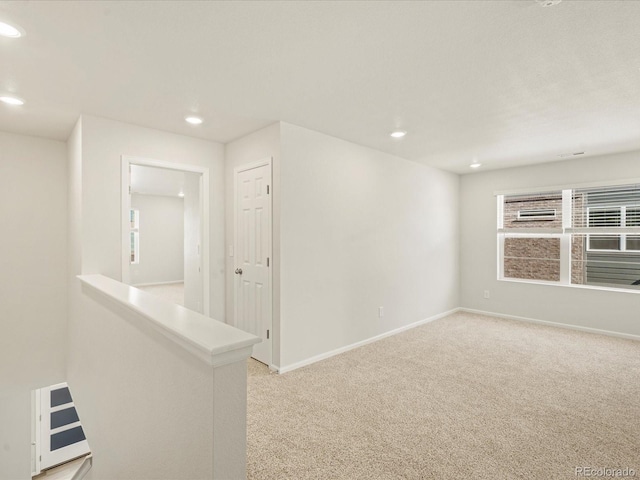 carpeted spare room with a wealth of natural light