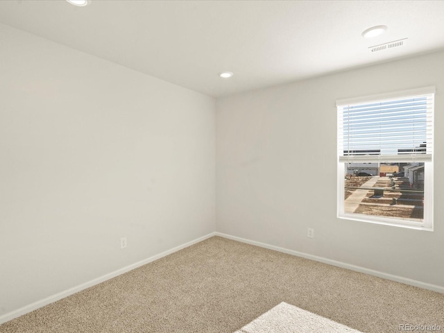 empty room featuring carpet flooring