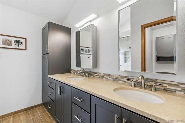 5040 Sweetgrass Ln, Colorado Springs, CO 80922 - full bathroom featuring double vanity, baseboards, and wood finished floors