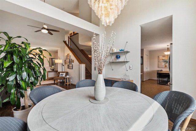 5040 Sweetgrass Ln, Colorado Springs, CO 80922 - dining area with stairway, a ceiling fan, and a chandelier