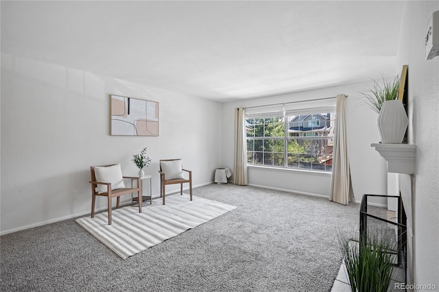 sitting room with carpet and baseboards