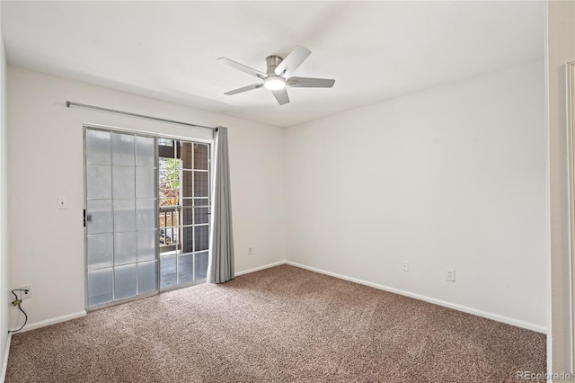 carpeted empty room featuring ceiling fan and baseboards