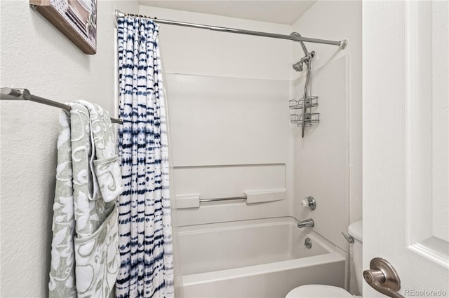 full bathroom featuring shower / bath combination with curtain and toilet