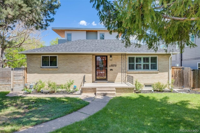 2090 Irving St, Denver, CO 80211 - view of front of house with brick siding, a gate, and roof with shingles