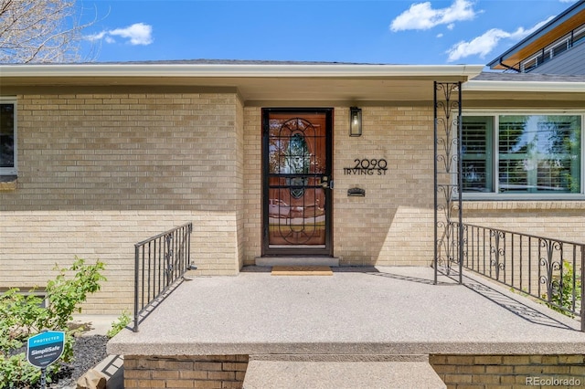 2090 Irving St, Denver, CO 80211 - property entrance featuring brick siding