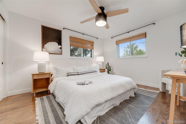 2090 Irving St, Denver, CO 80211 - bedroom with baseboards, light wood-style flooring, and ceiling fan