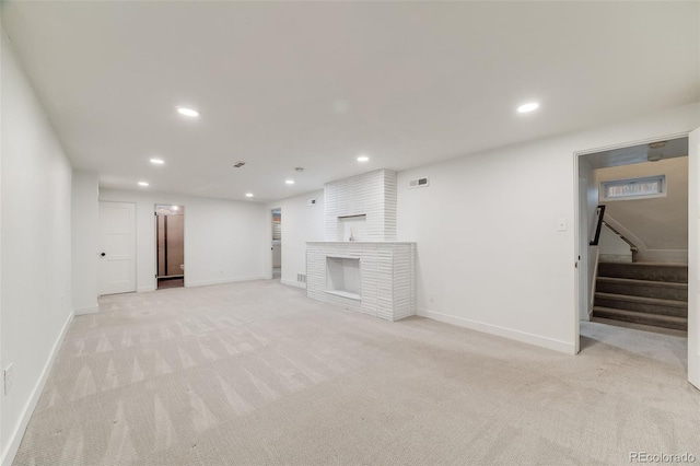 2090 Irving St, Denver, CO 80211 - unfurnished living room with baseboards, light colored carpet, recessed lighting, stairs, and a fireplace