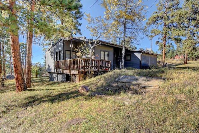6805 Marshmerry Ln, Evergreen, CO 80439 - rear view of house featuring a wooden deck