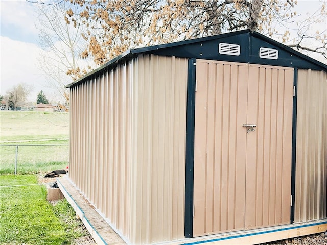 view of shed with fence