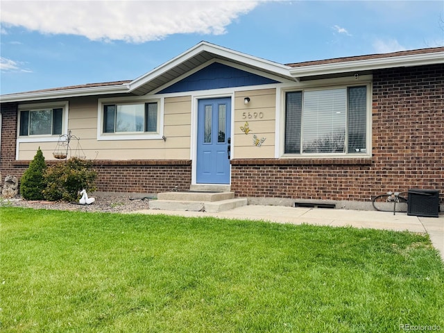 5690 W 79th Ave, Arvada, CO 80003 - single story home with brick siding and a front yard