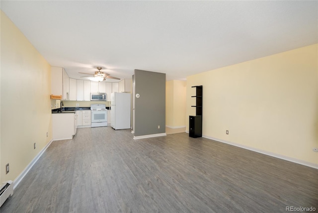 unfurnished living room featuring a baseboard radiator, sink, light wood-type flooring, and ceiling fan