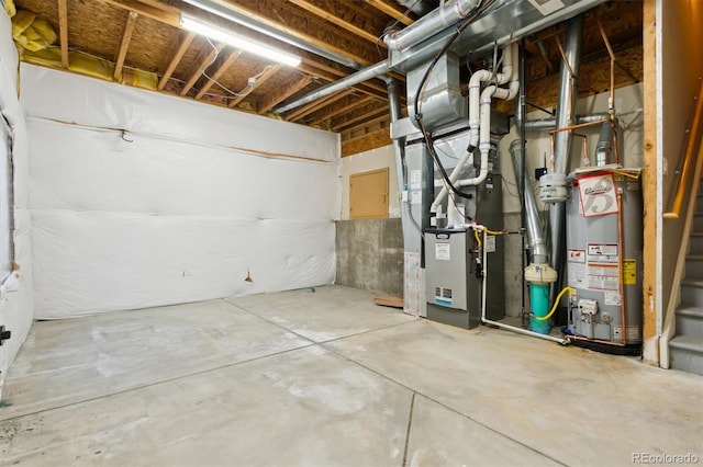 basement with water heater and heating unit