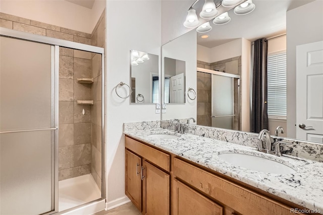 25561 E 5th Pl, Aurora, CO 80018 - bathroom with a stall shower and double vanity