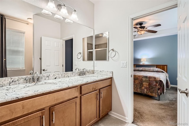 25561 E 5th Pl, Aurora, CO 80018 - ensuite bathroom with ceiling fan, double vanity, baseboards, and an enclosed shower