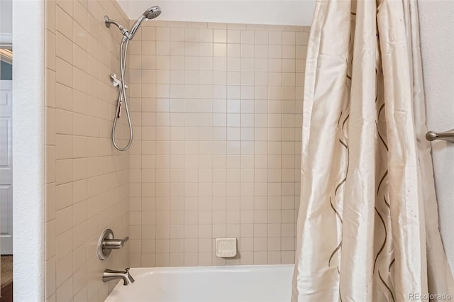 25561 E 5th Pl, Aurora, CO 80018 - bathroom featuring shower / bath combo with shower curtain