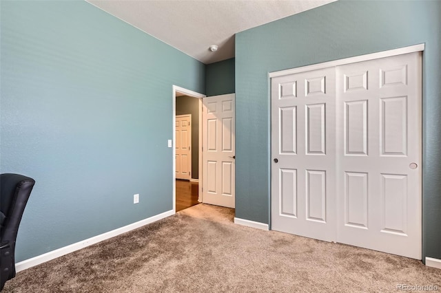 25561 E 5th Pl, Aurora, CO 80018 - unfurnished bedroom featuring carpet, a closet, and baseboards