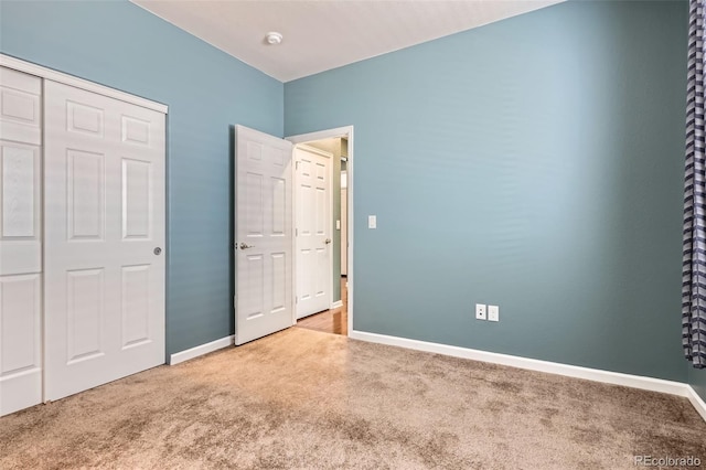 25561 E 5th Pl, Aurora, CO 80018 - unfurnished bedroom with carpet flooring, baseboards, and a closet