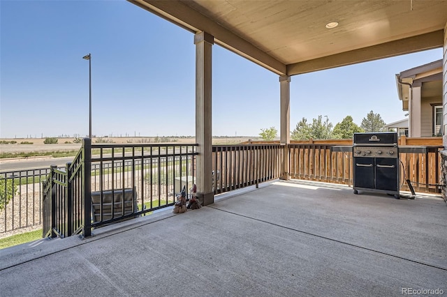 25561 E 5th Pl, Aurora, CO 80018 - view of patio with grilling area and a balcony