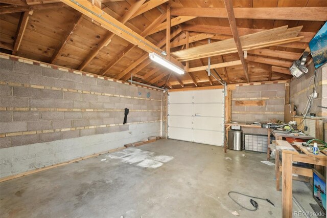 garage featuring concrete block wall