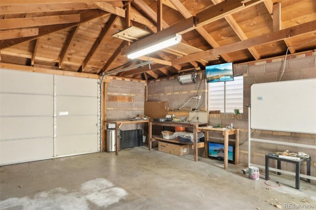 garage featuring concrete block wall