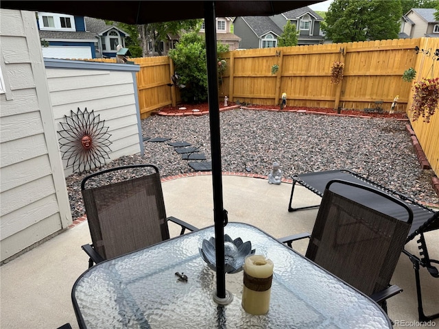 6887 S Dover Way, Littleton, CO 80128 - fenced backyard with a patio and outdoor dining area