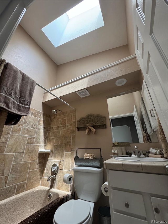 6887 S Dover Way, Littleton, CO 80128 - bathroom featuring a skylight, shower / washtub combination, vanity, and toilet