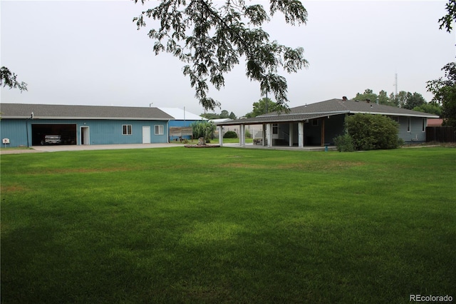 view of yard with a garage