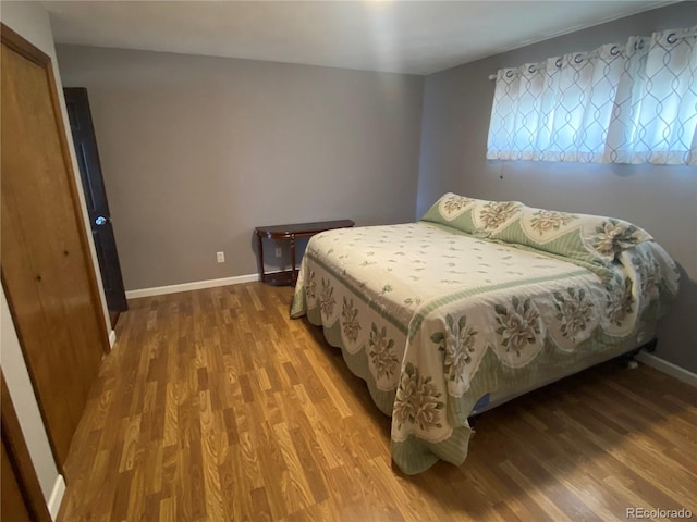 bedroom featuring hardwood / wood-style flooring