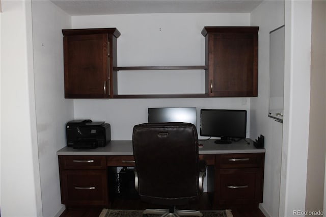 office featuring built in desk and wood-type flooring