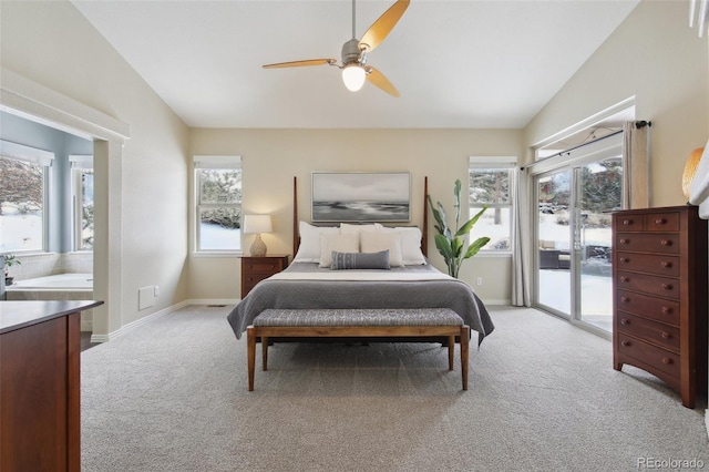 bedroom featuring lofted ceiling, access to exterior, and light colored carpet