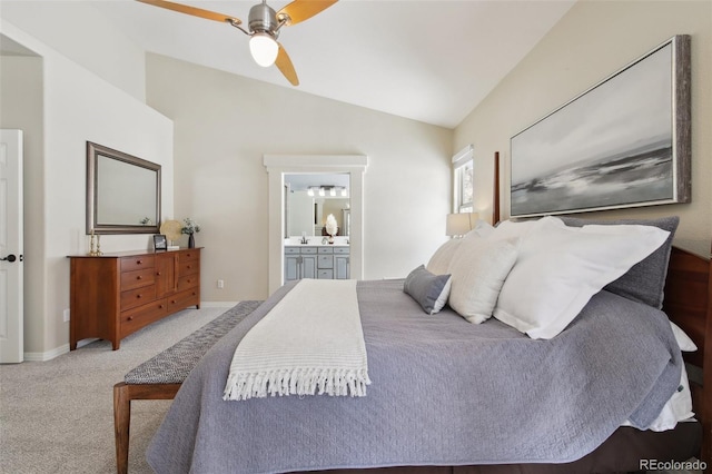 bedroom featuring sink, ensuite bath, ceiling fan, carpet, and vaulted ceiling