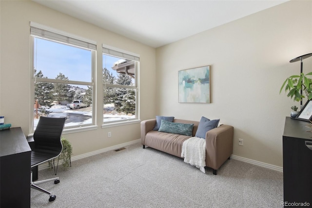 office space with light colored carpet