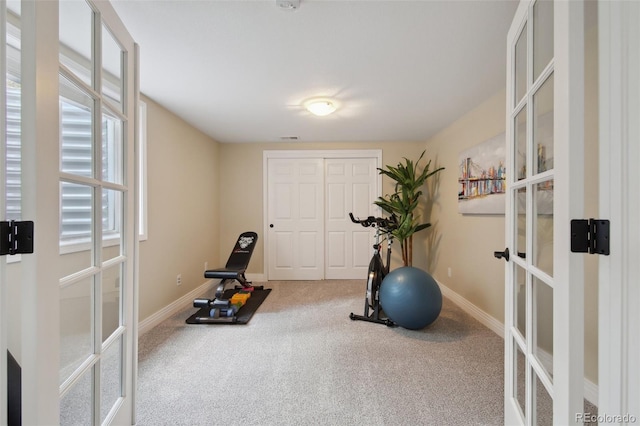 workout area with french doors and carpet flooring