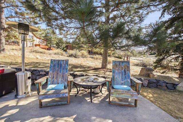 view of patio featuring an outdoor fire pit