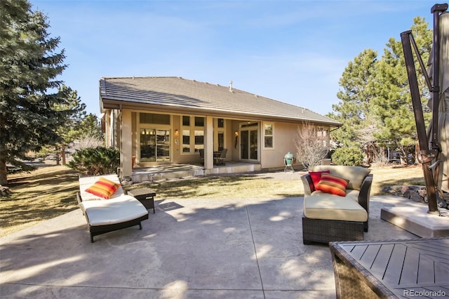 rear view of house with a patio