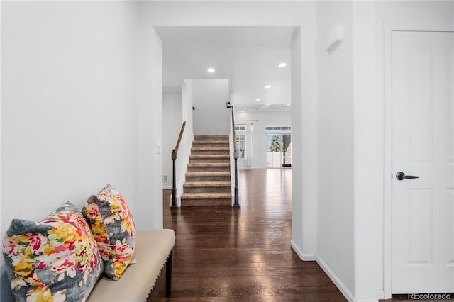 hall featuring stairway, recessed lighting, baseboards, and wood finished floors