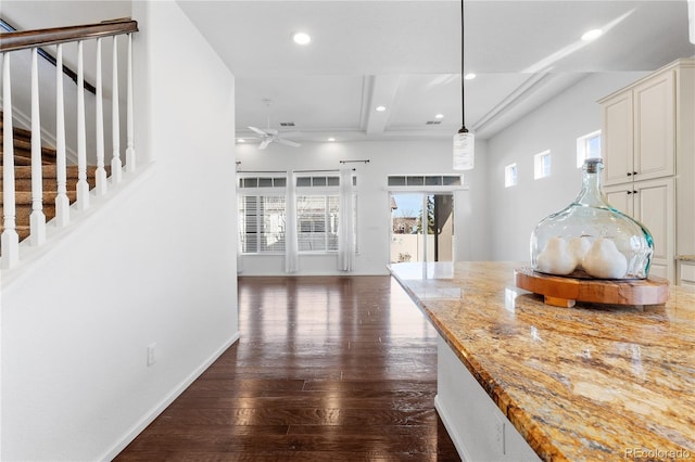 interior space featuring light stone counters, plenty of natural light, recessed lighting, and dark wood-style flooring