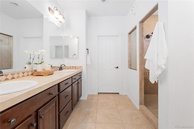 full bathroom with a sink, walk in shower, tile patterned floors, and double vanity