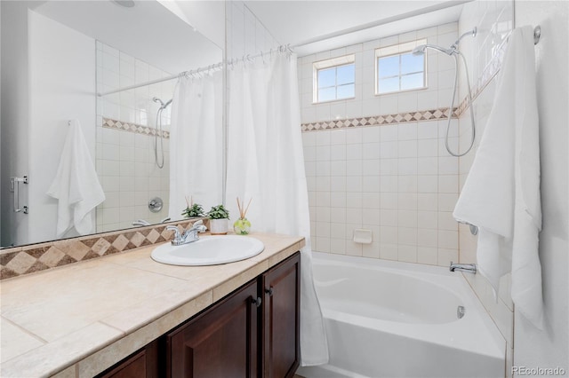 bathroom with shower / bath combo with shower curtain and vanity